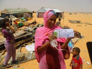 Woman from the Leimghetty neighbourhood of Dar Naim near Nouakchott shows her legal title to build on the land where the state just destroyed her home and is now ignoring demands for re-housing or compensation